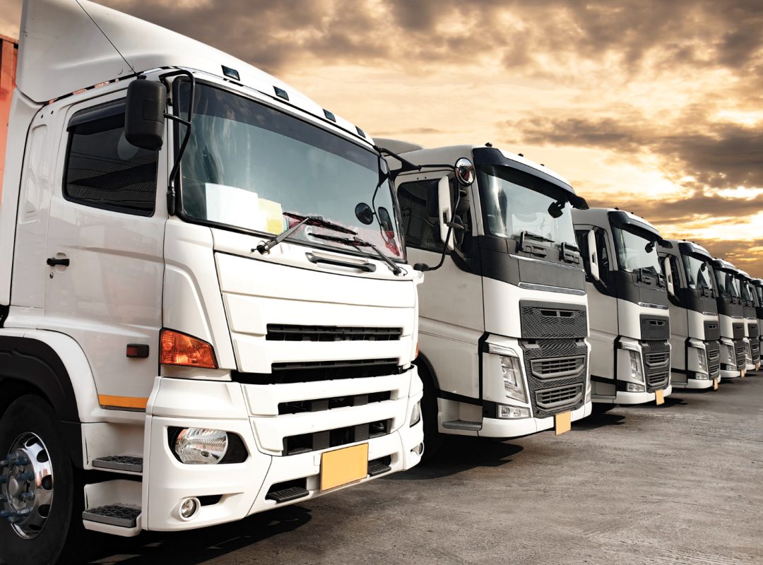 trucks-parked-lined-up-sunset-sky-road-freight-industry-logistics-transport trucks-parked-lined-up-sunset-sky-road-freight-industry-logistics-transport